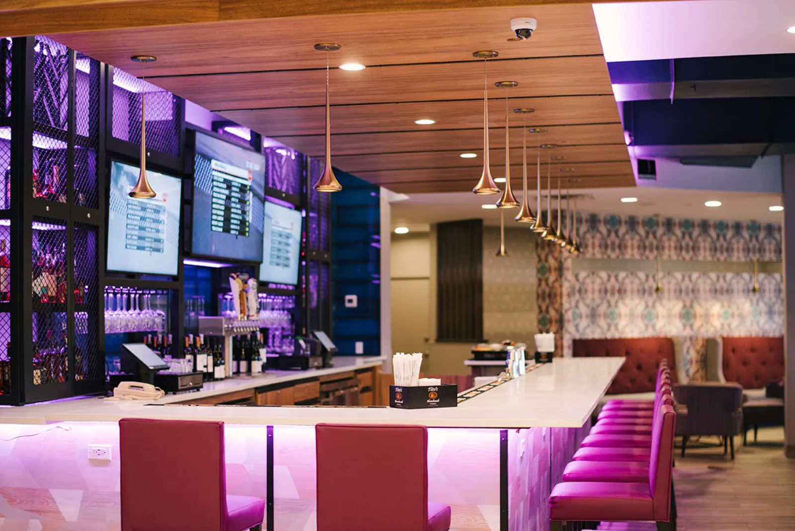 Infused Restaurant + Bar with magenta lounge lighting